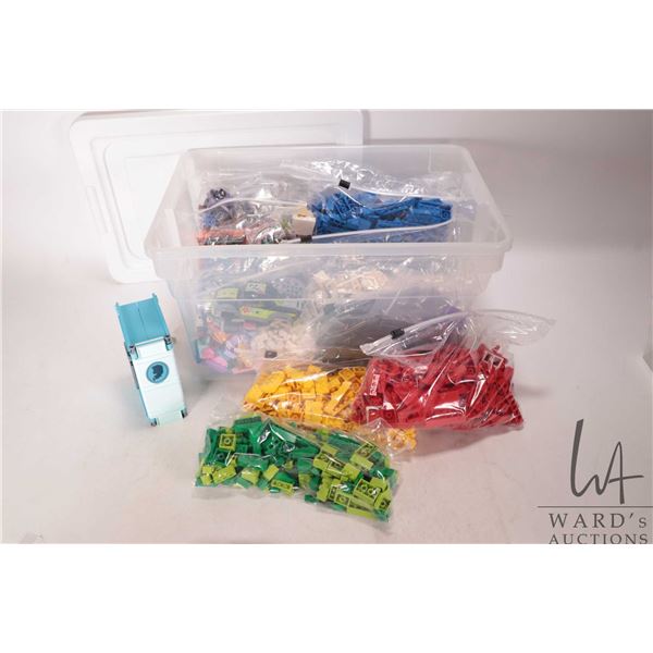 Plastic tote of assorted Lego building bricks and accessories