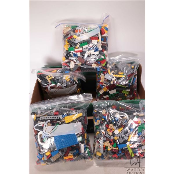 Five bags of mixed Lego building bricks