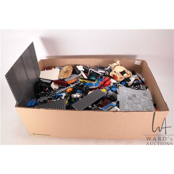 Large box of Lego building bricks and accessories