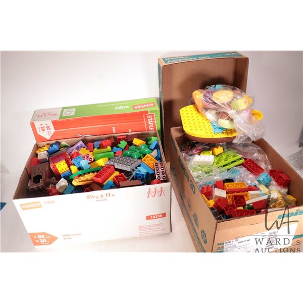 Two boxes containing a large selection of Duplo building bricks and accessories