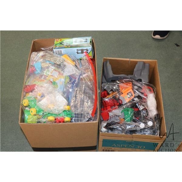 Two boxes and two base of Duplo building bricks