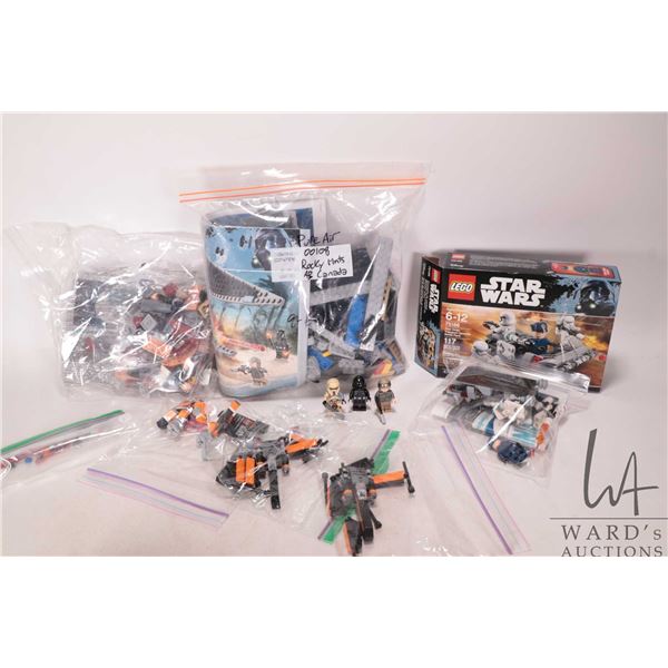 Three Lego "Star Wars" pre-built kits including no. 75154 TIE Striker with manual, no. 75173 Luke's 