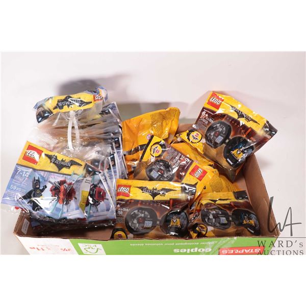 Twenty factory sealed mini Lego kits and seven factory sealed Minifigure kits