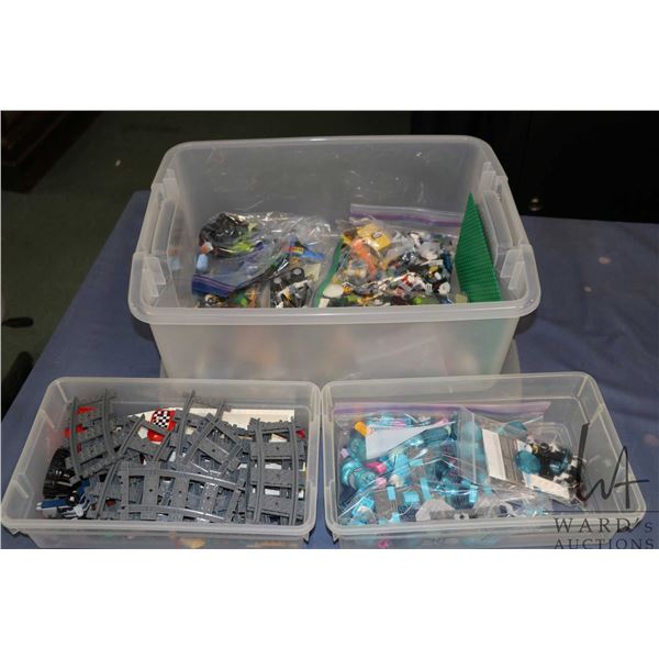 Plastic tub containing a selection of assorted Lego building bricks and accessories