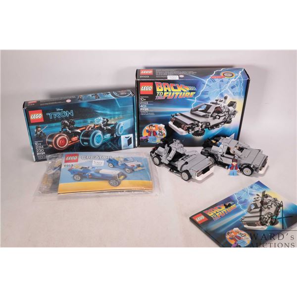 Three Lego kits including factory sealed "Disney Tron Legacy "no. 21314 kit, Lego "Back to the Futur