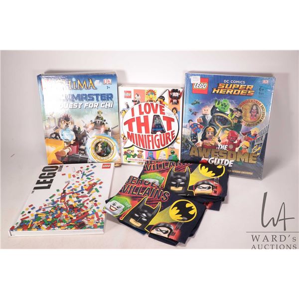 Four Lego hardcover books including "The Lego Book", "DC Comics Super Heroes-Awesome Guide" with Min