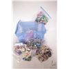 Image 1 : Blue plastic tote containing a selection of Lego building bricks, pre-built kits including "Friends"
