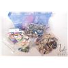Image 2 : Blue plastic tote containing a selection of Lego building bricks, pre-built kits including "Friends"
