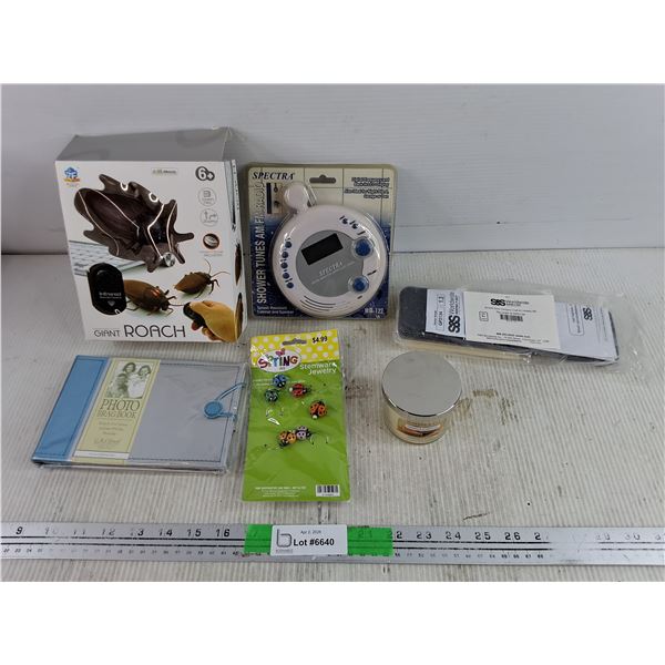 Giant Roach, Photo Brag Book, Spectra AM/FM Radio, Scented Candle, Misc