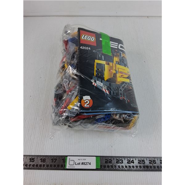 Bag of TechNic Lego Instructions and Various Pieces