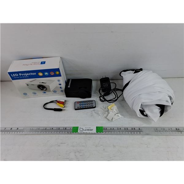 LED Projector w/ White Background - Powers On, As Is