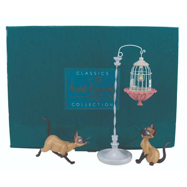 A WDCC"Lady and the Tramp" Si & Am Figurine Set.