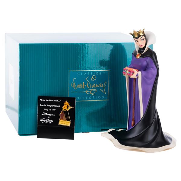 A WDCC Evil Queen Figurine and Pin.