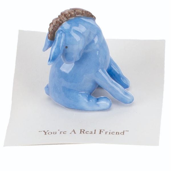 A Mini "Winnie the Pooh" Eeyore Figurine.