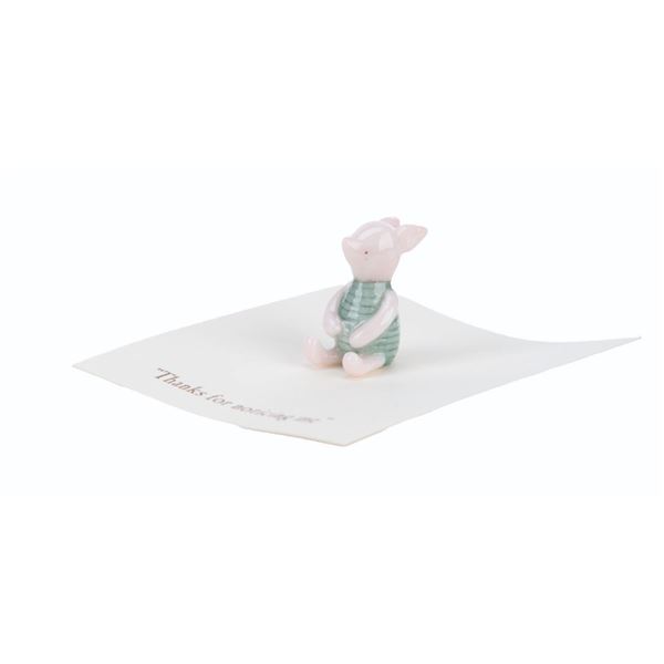 A Mini "Winnie the Pooh" Piglet Figurine.