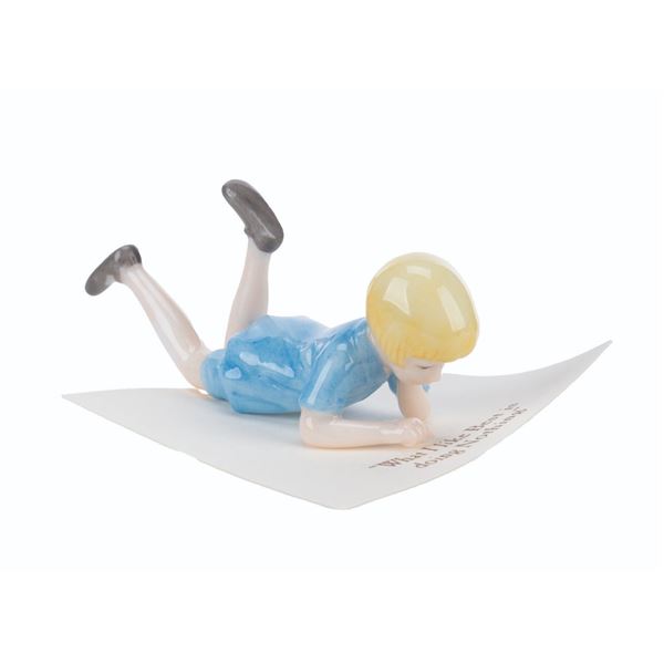 A Mini "Winnie the Pooh" Christopher Robin Figurine.