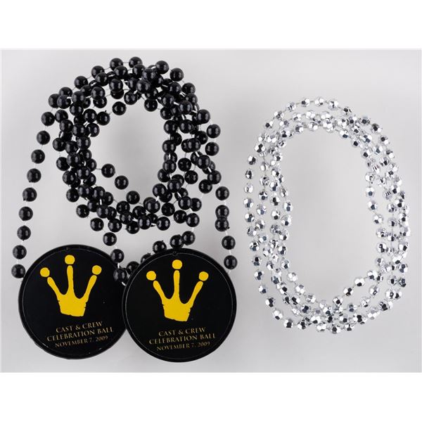 A Pair of "The Princess and the Frog" Crew Celebration Necklaces.