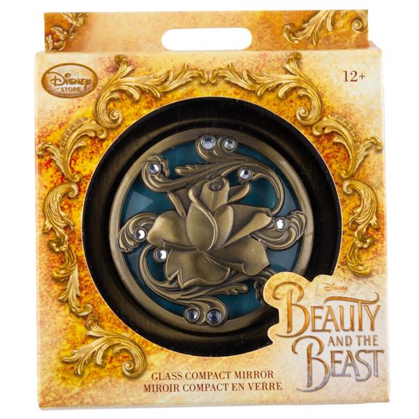 A "Beauty and the Beast" Glass Compact Mirror.