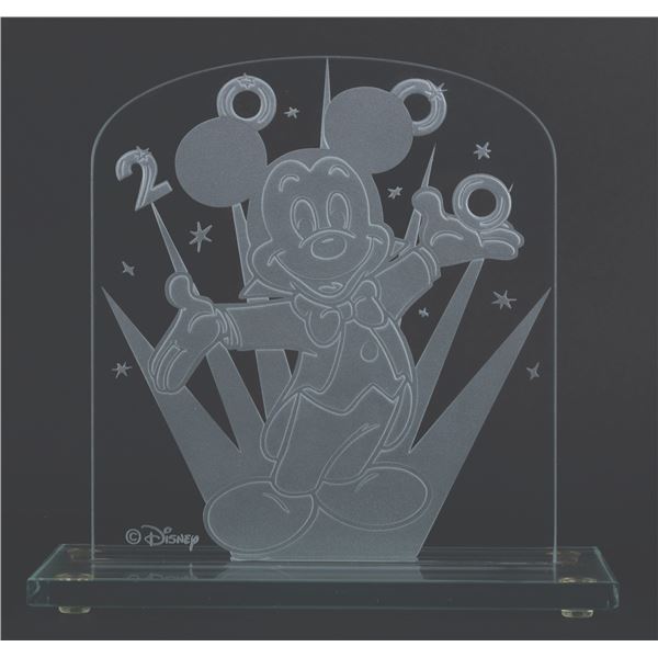 A Millennium Mickey Etched Glass Plaque.
