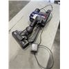 Image 2 : DYSON V7 WITH CHARGER. WORKING. DOES NOT HAVE A STICK