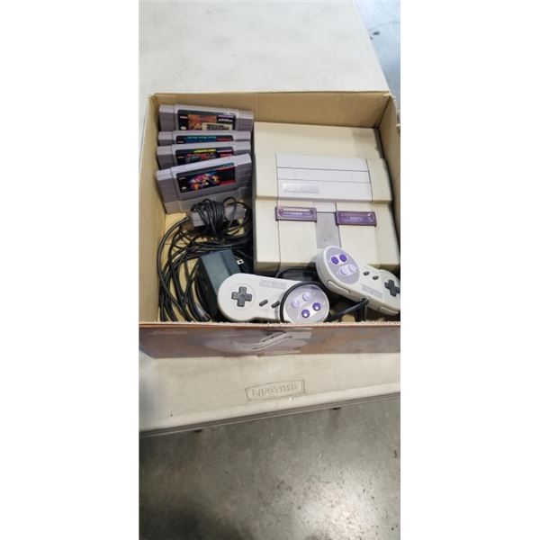 SUPER NINTENDO CONSOLE WITH 2 CONTROLLERS, POWER SUPPLY AND 4 GAMES