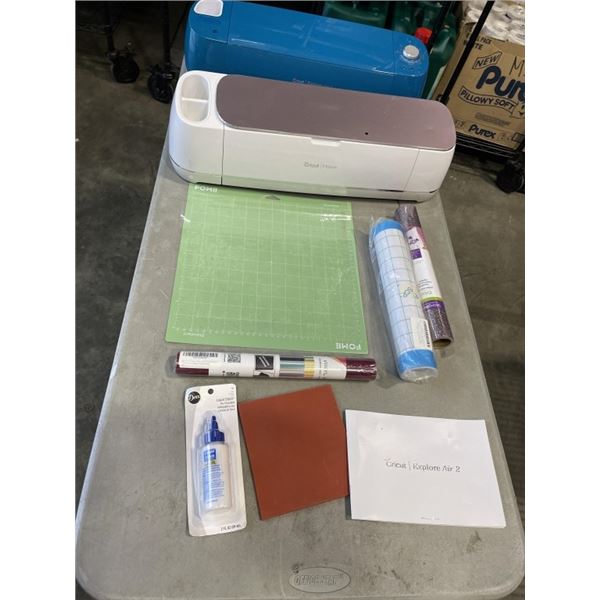 CRICUT EXPLORE AIR AND CRICUT MAKER MACHGINES, NO CABLES UNTESTED, AND ASOSRTED VINLY AND ACCESSORIE