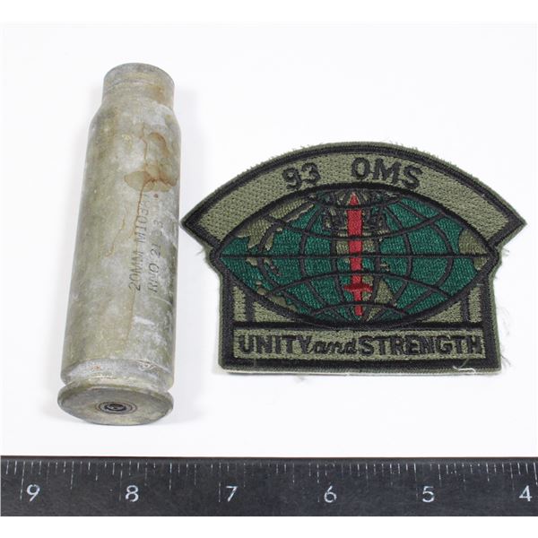 20 MM DUMMY ROUND CASING WITH A MILITARY PATCH