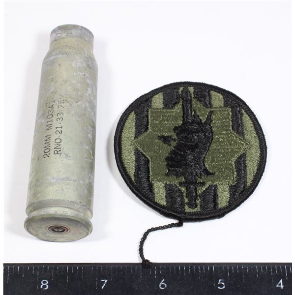 20 MM DUMMY ROUND CASING WITH A MILITARY PATCH