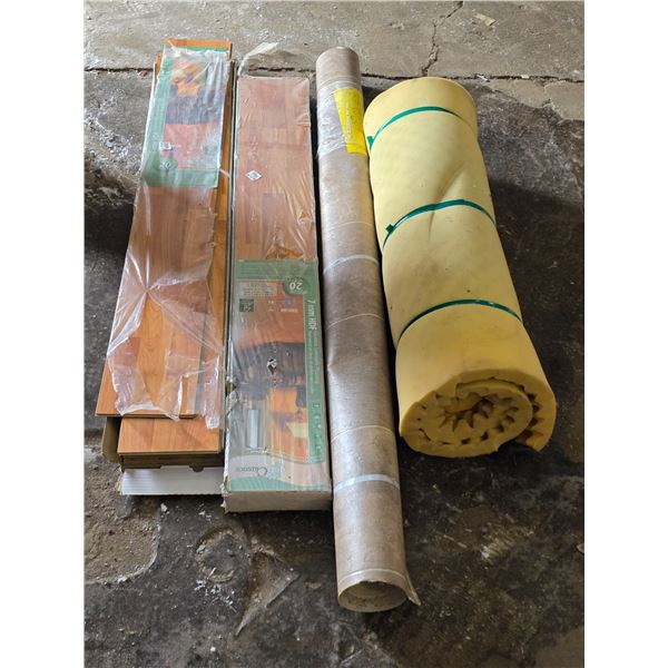 2 boxes of laminate flooring, roll of flooring and roll of foam
