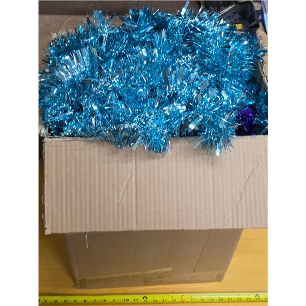 Box of various christmas tinsel