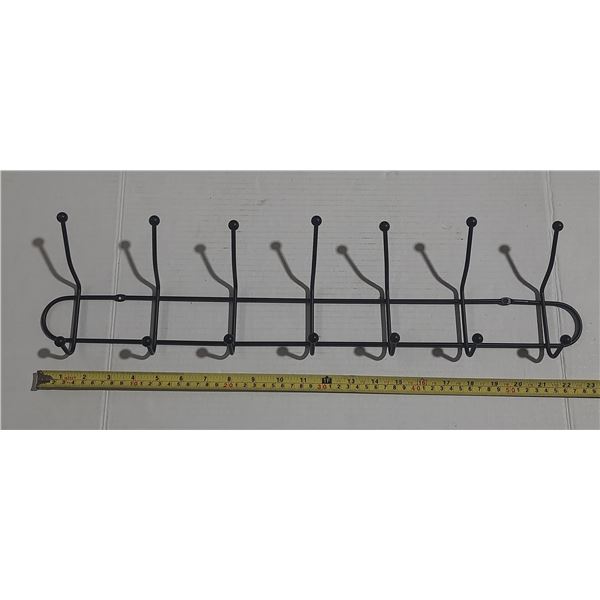 Black metal wall-mounted coat rack with 7 hooks.