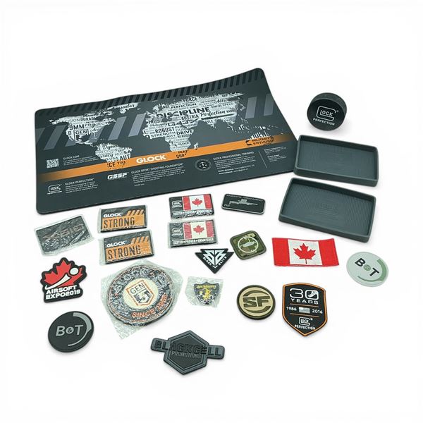 Assorted Firearms Patches, Glock Rubber Trays X 2 Qty, Glock Hockey Puck and Glock 20" x 12" Mat