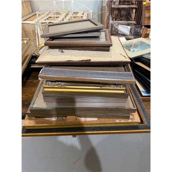 Stack of Assorted Picture Frames * Wide range of sizes, materials, and eras * Majority are empty