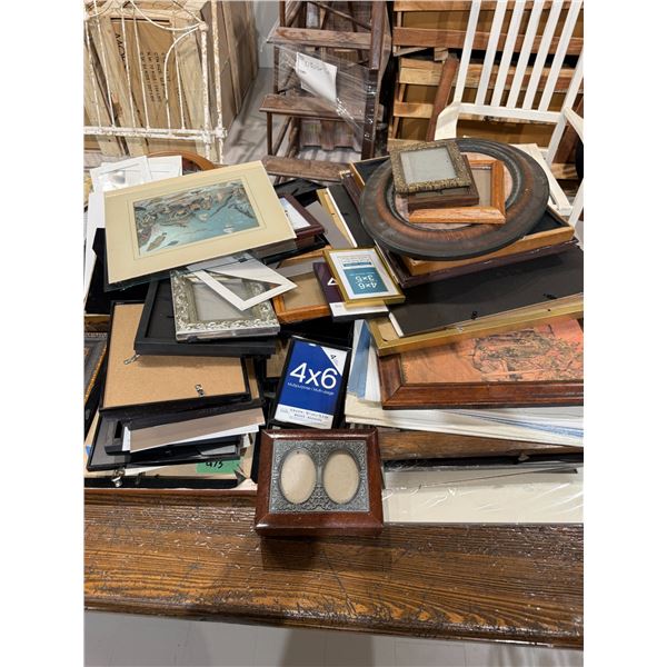 2 Stacks of Assorted Picture Frames * Wide range of sizes, materials, and eras * Majority are empty