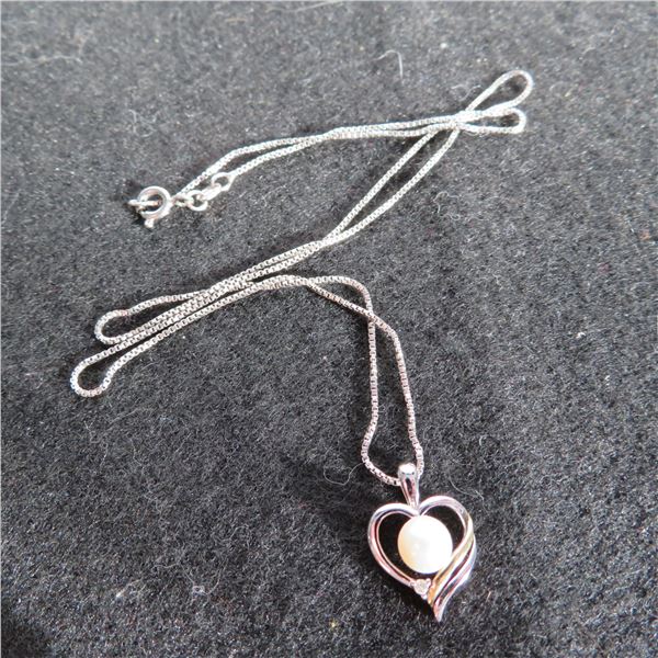 925 pendant on 18" chain.  Chain is marked 925.  Pendant is marked 925 & 14K