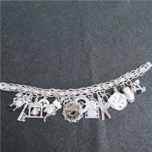 Vintage Sterling silver charm bracelet with 16 charms.  Beautiful!
