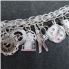 Image 4 : Vintage Sterling silver charm bracelet with 16 charms.  Beautiful!