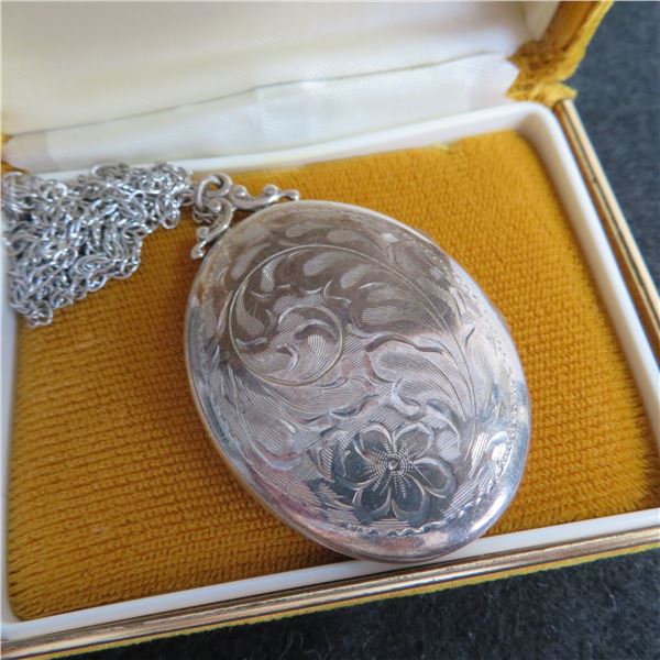 Sterling locket and 20"chain.  Beautiful large vintage locket!   Both marked STERLING