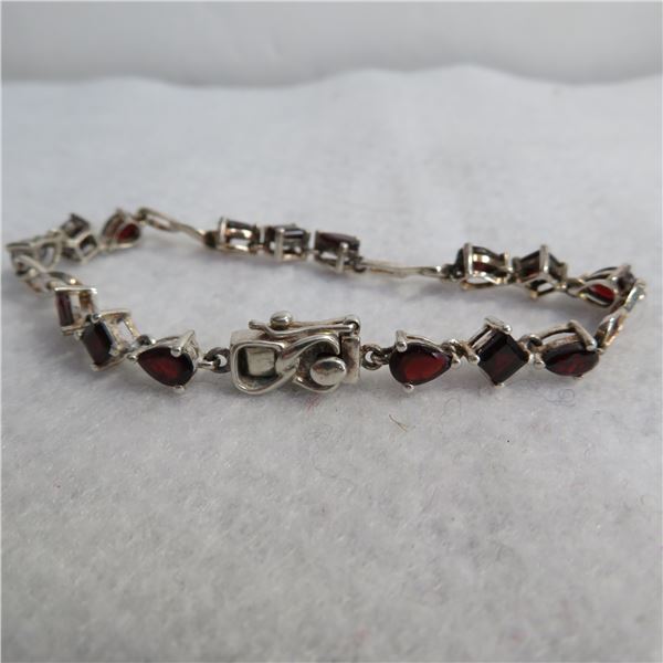 925 bracelet with deep red/amber coloured stones.  Really nice - seems well made.  Marked 925