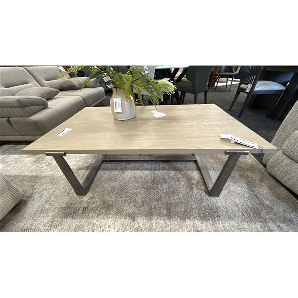 ASHLEY FURNITURE DALANVILLE RECTANGULAR COFFEE TABLE. 55" X 31" INC CERAMIC POT AND ARTIFICIAL PL...