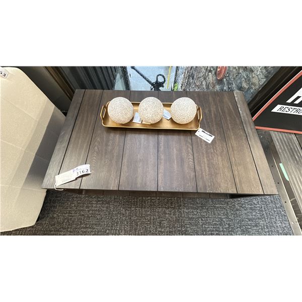 MAGNUSSEN FURNITURE RETANGULAR COCKTAIL TABLE W/CASTERS. 48" X 28". W/GOLD POSY TRAY.