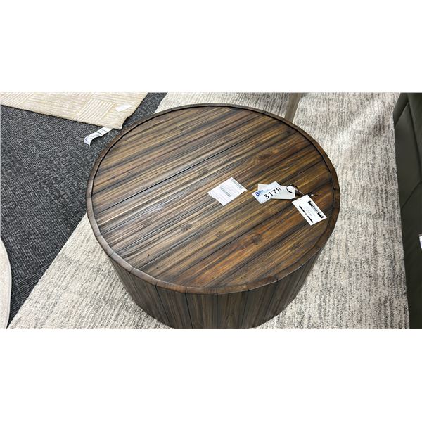 MAGNUSSEN FURNITURE COCKTAIL TABLE W/CASTERS. 34" DIAMETER.