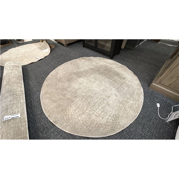 6'7" ROUND SURYA MASTERPIECE AREA CARPET.