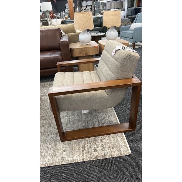 PALLISER WYATT UPHOLSTERED LOUNGE CHAIR. WOOD FRAME.