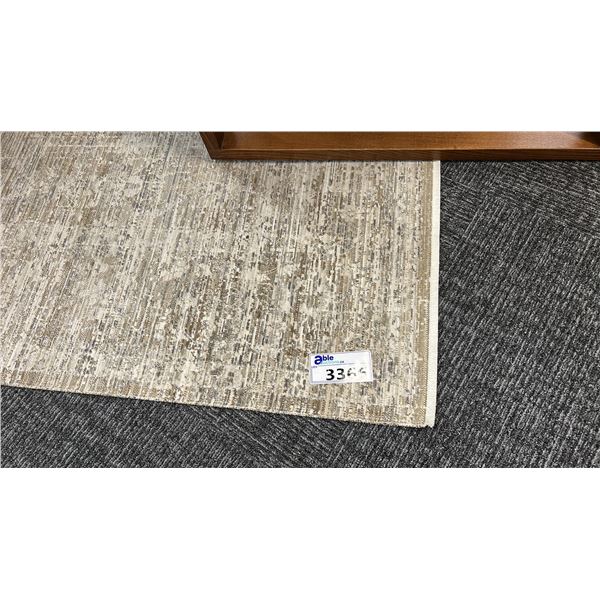 10' X 8' BEIGE CARPET.