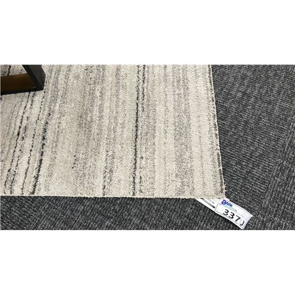 10' X 7'10" SURYA GAVIC 42 POUND RUG.