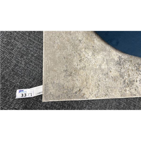 10' X 7'10" SURYA CARAMEL 40 POUND RUG.