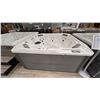 Image 1 : HOTSPRINGS HOT SPOT. RHYTHM, 7 SEAT HOT TUB, 40 JETS, 330 GALLONS, FRESH WATER SALT SYSTEM.