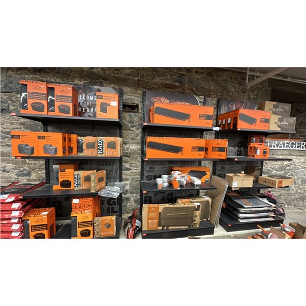 GROUP LOT OF TRAEGER STORE DISPLAYS AND MERCHANDISE. APPROX. 18 GRILL COVERS. GRILL BLANKETS.