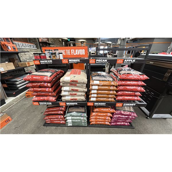 GROUP LOT OF APPROX. 40 BAGS OF ASSORT WOOD PELLETS WITH THE RACKS THAT THE PELLETS ARE ON.